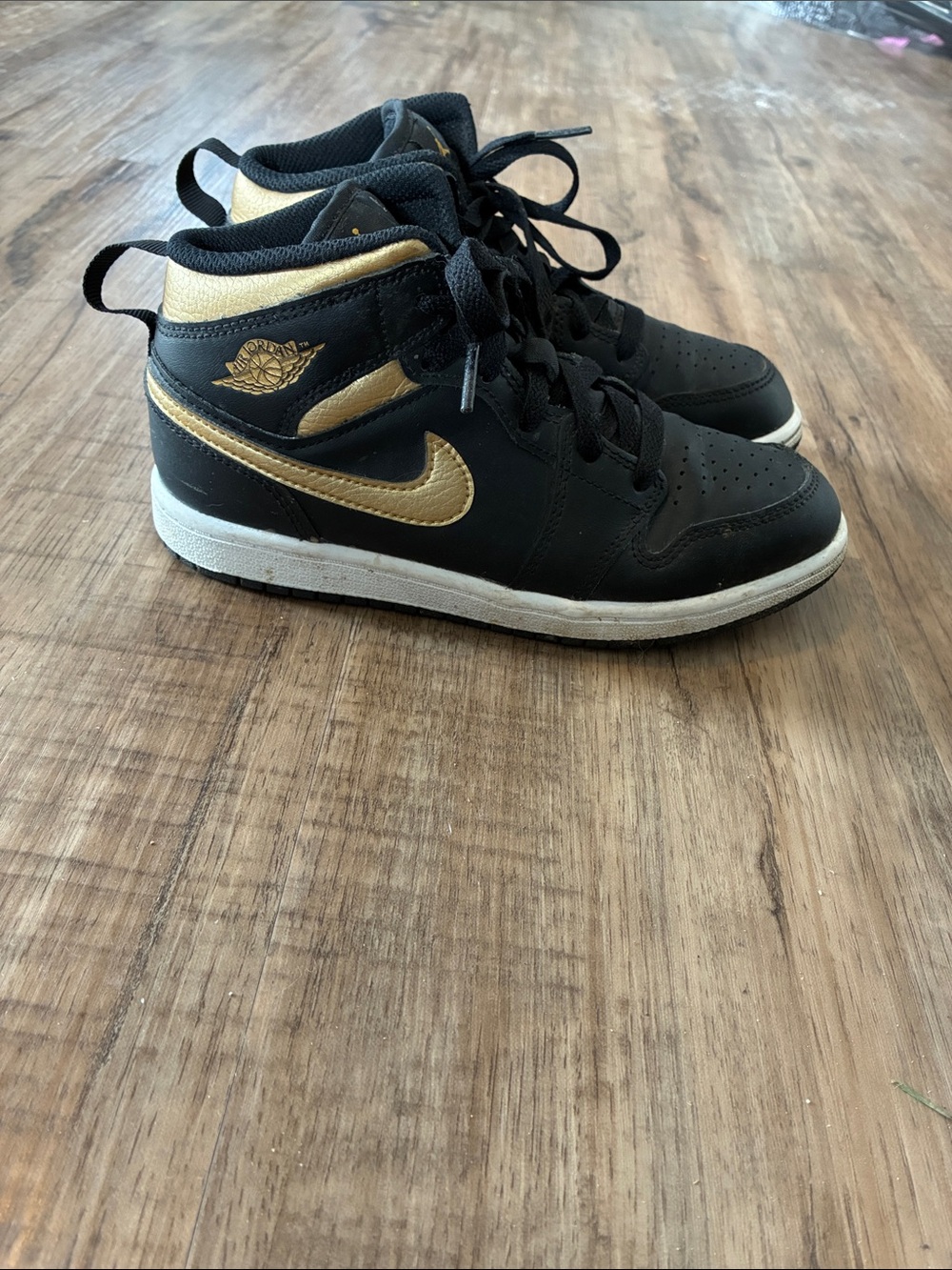 Nike Jordans Kids Black and Gold Mid-Top Sneakers